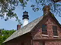 Royalty Free Stock Video HD Footage View of Lighthouse Keeper’s House and Cape Florida Lighthouse on Key Biscayne in Miami,  Florida