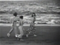 Tasmanian countryside, Hobart and Tasmanian Tiger (c1932) - Clip 1: Women walking along the beach