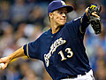 Greinke limits Padres,  gets first win