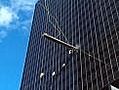 Window washers hold on in high winds
