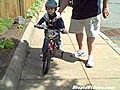 Cute Kid Learns To Ride A Bicycle