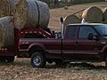 Trucks Hauling Hay Bales Stock Footage