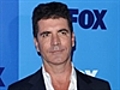 ShowBiz Minute: Cowell,  Warren, Black Eyed Peas