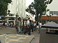 Royalty Free Stock Video SD Footage Zoom Out to People Using Public Phones and Streets in San Jose,  Costa Rica