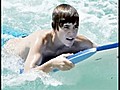 Justin Bieber takes the plunge in Barbados