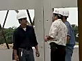 Royalty Free Stock Video SD Footage General Contractor Talks to Workers at a Construction Site in Ft. Lauderdale,  Florida