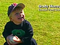 Trembley gives a young fan an Orioles hat