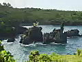 Royalty Free Stock Video SD Footage Zoom Into Rocks and Coastline Near Black Sand Beach at Hana in Maui,  Hawaii