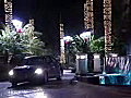 Royalty Free Stock Video SD Footage Zoom Out to Holiday Lights and Car in Driveway on the New River in Downtown Ft. Lauderdale,  Florida