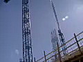 Royalty Free Stock Video SD Footage Pan Up to Tower Cranes Operating at a Construction Project in Ft. Lauderdale,  Florida