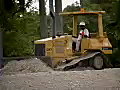 Royalty Free Stock Video SD Footage Heavy Equipment Bulldozer Moving Dirt on a Road Construction Project in Ft. Lauderdale,  Florida