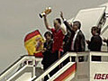 Triumphant homecoming for Spain