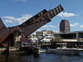 Royalty Free Stock Video HD Footage Railroad Bridge is Lowered as Boats Pass by on the New River in Downtown Ft. Lauderdale,  Florida