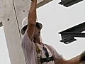 Royalty Free Stock Video SD Footage Steel Worker Adjusts a Steel Roof Joist at a Construction Site in Ft. Lauderdale,  Florida