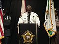 Miami-Dade Police chaplain gives the invocation at memorial for two officers killed Jan. 20.