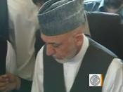 Karzai mourns dead half-brother,  climbs in grave
