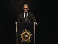 Miami-Dade Mayor Carlos Alvarez addresses the memorial service for two slain officers