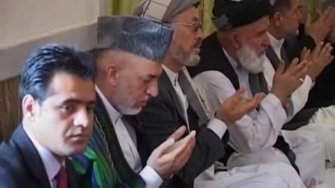 Karzai attends service for brother