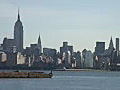 Royalty Free Stock Video HD Footage Zoom Out From New York City Skyline and Empire State Building From New Jersey