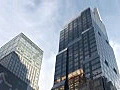 Royalty Free Stock Video HD Footage Pan Left and Up to Buildings in Times Square in New York City