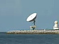 Royalty Free Stock Video HD Footage Zoom Out from view of a Satellite Dish From the Most Southern Point in Key WEest,  Florida