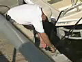 Royalty Free Stock Video SD Footage Supervisor Boards a Small Boat at a Dry Dock and Boat Yard in Ft. Lauderdale,  Florida