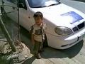 this baby playing with a car