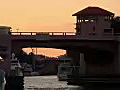 Stock Video Boat Passes Under 3rd Ave Bridge on the New River in Ft. Lauderdale at Sunset Royalty-Free HD Footage