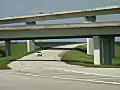 Royalty Free Stock Video HD Footage Zoom Out to View of Roadways,  Bridges and Traffic on I-595 in South Florida