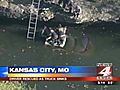 Rescuers work frantically to free driver from sinking truck