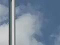 Royalty Free Stock Video HD Footage Light pole and Blue Sky on a Clear Day in South Florida