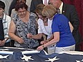 Members of Congress Stitch Flag Destroyed on 9/11