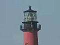 Royalty Free Stock Video HD Footage Zoom Out to View of the Lighthouse at Jupiter Inlet in Florida