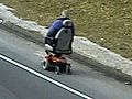 Man Rides Down Highway In Wheelchair