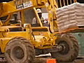 Royalty Free Stock Video SD Footage Forklift Moves Bags of Cement at a Construction Project in Ft. Lauderdale,  Florida