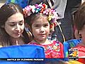 San Antonians enjoy a soggy Battle of Flowers parade