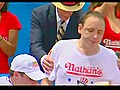 Speed-eating king downs 62 hot dogs in ten minutes