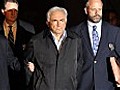 Dominique Strauss-Kahn escorted by police after forensic exam