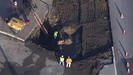 Water Main Break Grows Into Sinkhole