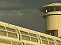 Royalty Free Stock Video SD Footage Zoom Out From Airport Ramp Control Tower at the Orlando Airport in Florida