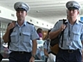 Police arrive home from NZ disaster