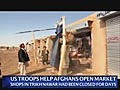 US marines assist Afghans to open market near Marjah