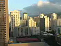 Royalty Free Stock Video HD Footage Pan Left to Hotels and Buildings at Waikiki Beach in Hawaii