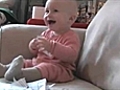 Baby laughs at ripping paper