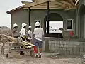 Royalty Free Stock Video SD Footage Contractor iscuss Building Plans With a Crew at a Construction Site in Ft. Lauderdale,  Florida