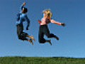 Man and woman jumping with excitement,  slow motion