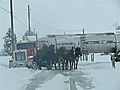 Horses Pull Truck Out of Snow