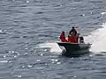 Royalty Free Stock Video SD Footage Small Powerboat Passes by in the Inside Passage Waterway,  Alaska