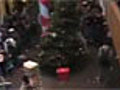 Kid jumps on Christmas tree