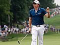 McIlroy shoots 65,  takes U.S. Open lead